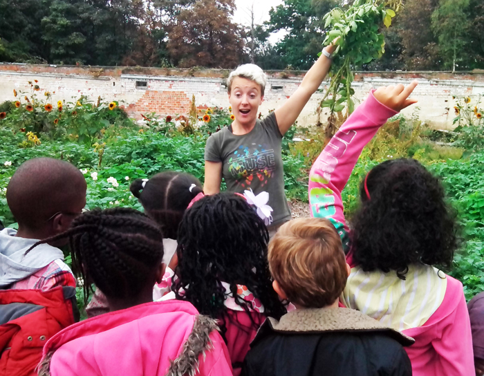 School children learning about potatoes at the Harvest Festival in the Walled Garden