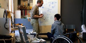 maker in residence kang cheng and dan chambers from draft wheelchairs disprupt disability prototyping session.